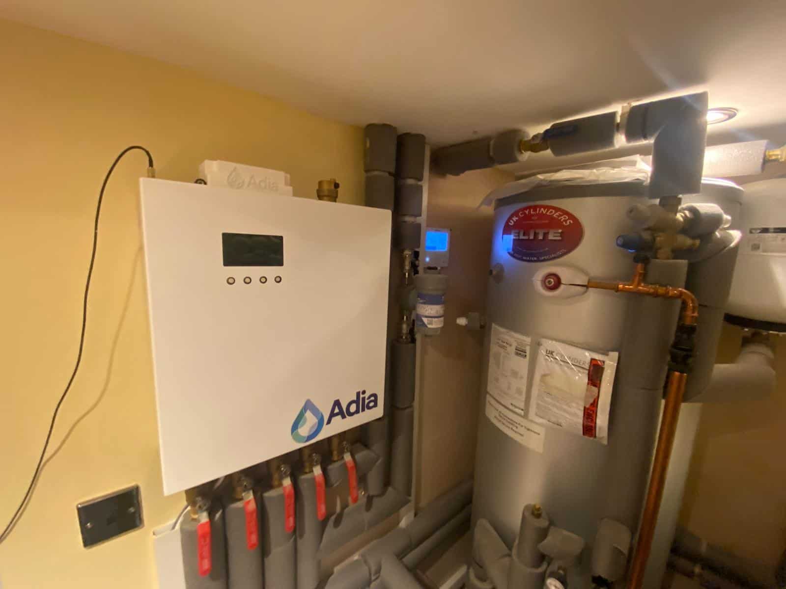 Adia intelligent hydraulic balancing system installed alongside a 250-litre Elite hot water cylinder for an air source heat pump.