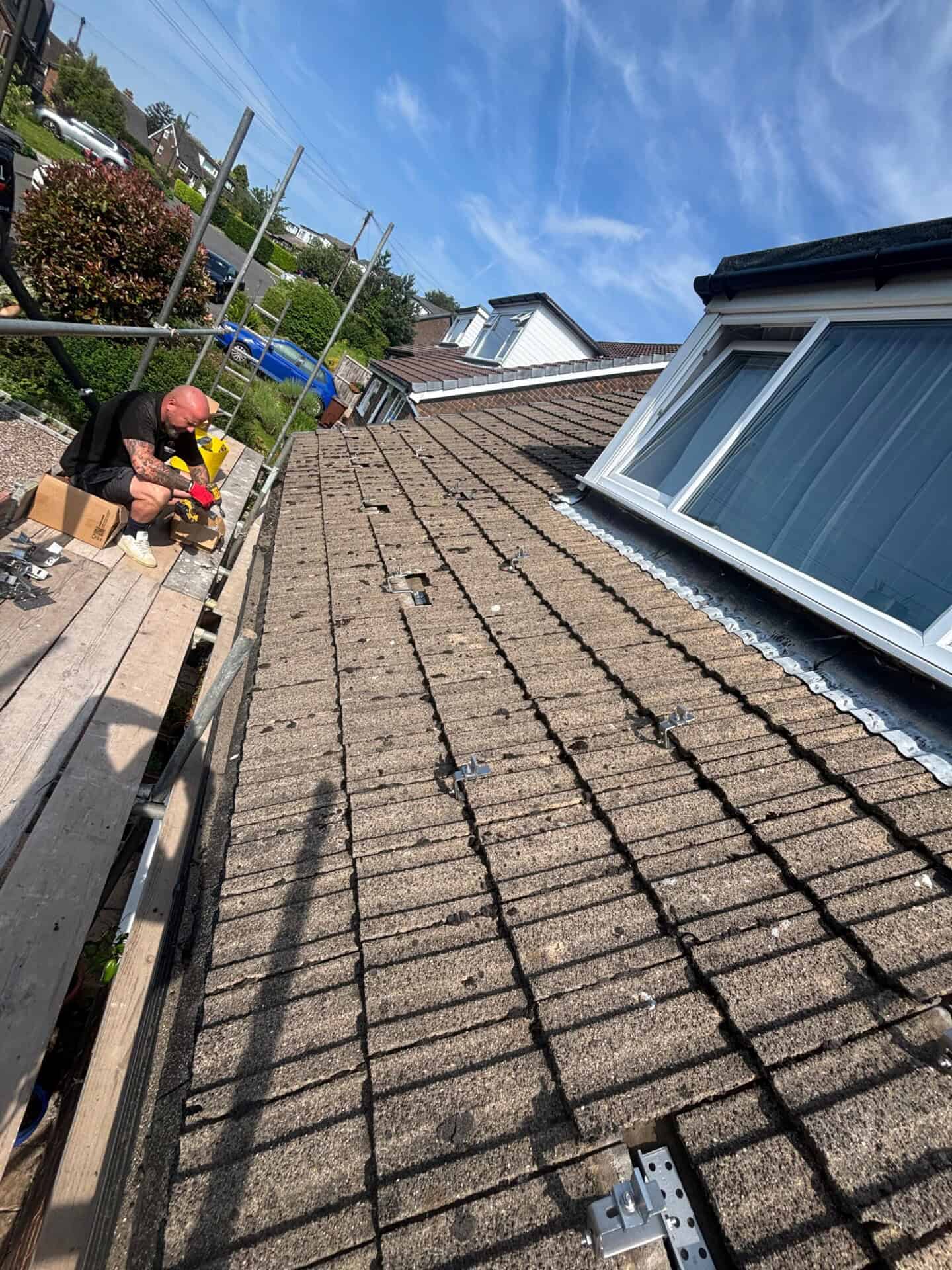 Roof mounting brackets installed in preparation for a solar panel installation.