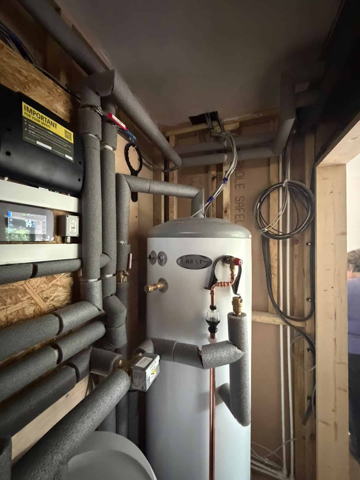 Grant Quick Recovery Twin Coil 250L hot water cylinder installed as part of an air source heat pump heating system.
